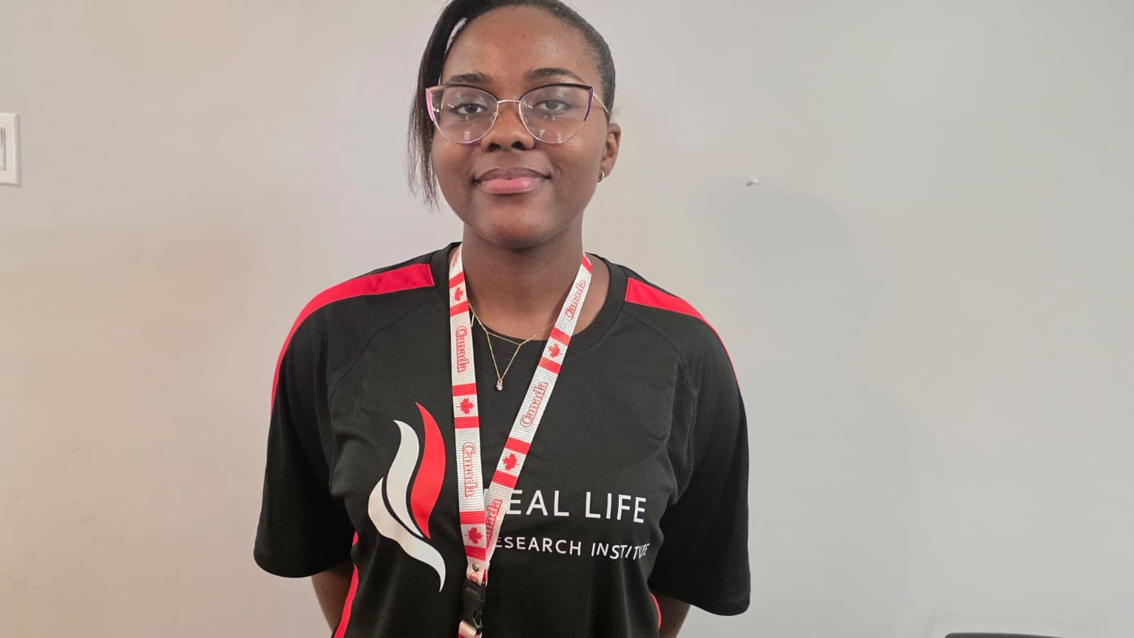 RLRI volunteer in a red team shirt visiting a museum exhibit